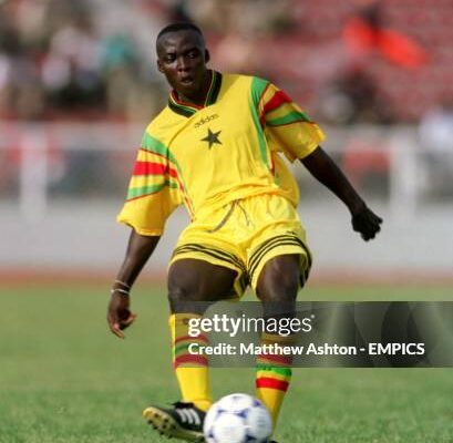 George Blay Ghana Photo by Matthew AshtonEMPICS via Getty Images | Ghanaguardian.com Soccer player in yellow kit dribbling a ball on a grassy field with blurred stands in the background.