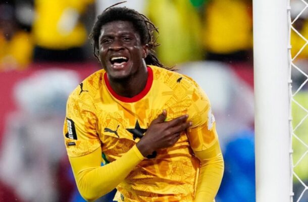 IMG_0996 | Ghanaguardian.com Soccer goalkeeper in a bright yellow jersey celebrates, hand to chest near the goalpost with a cheering crowd behind him.