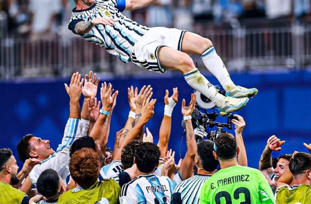 IMG_1215 | Ghanaguardian.com Argentina soccer players lift a teammate into the air in celebration on the field as fans cheer in the stands.