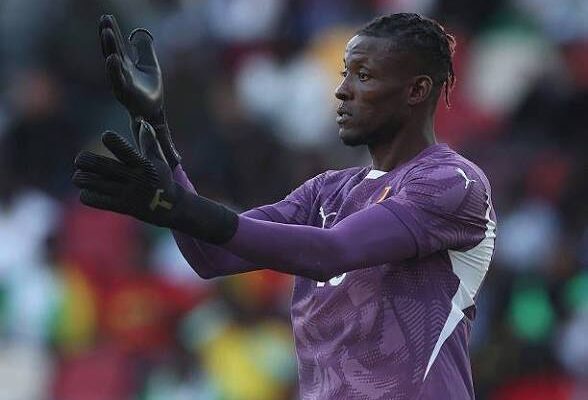 IMG_1272 | Ghanaguardian.com Soccer goalkeeper in a purple kit with black gloves claps and raises both hands on the field.