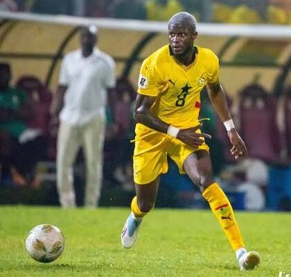 IMG_1298 | Ghanaguardian.com Soccer player in yellow uniform dribbling the ball on a green field during a match.