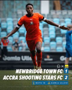 Soccer player in an orange kit celebrates on the pitch; scoreboard-style overlay shows Newbridge Town FC 1, Accra Shooting Stars FC 2.