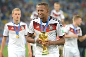 IMG_1333 | Ghanaguardian.com German national team players in white jerseys with medals, holding a golden trophy on the pitch after a victory
