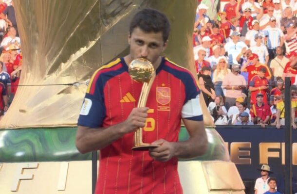 IMG_1335 | Ghanaguardian.com Spain national team player kissing the FIFA World Cup trophy on stage with a cheering crowd behind him.