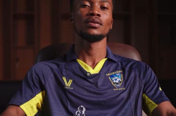IMG_1456 | Ghanaguardian.com Portrait of a man sitting in a chair, wearing a navy blue and yellow soccer jersey with team crest and sponsor logos (AngloGold Ashanti).