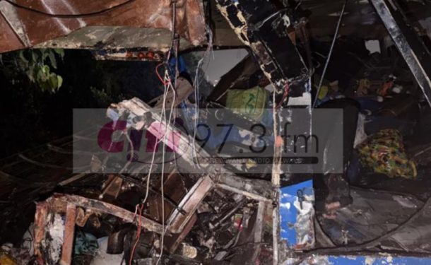 Untitled-design-750x375-1 | Ghanaguardian.com Charred debris and collapsed interior after a fire, with twisted metal and hanging wires among burned furniture pieces.