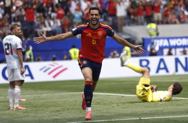 WhatsApp Image 2026-07-14 at 60038 PM | Ghanaguardian.com Spanish player in red jersey #6 celebrates with arms outstretched on the pitch as the goalkeeper lies on the ground behind him.
