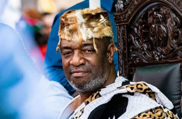 ga mantse | Ghanaguardian.com Man seated on an ornate carved chair wearing a fur crown and leopard-print cloak, looking at the camera.