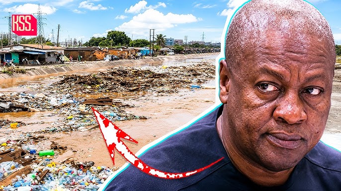 Portrait of a man looking to the side against a polluted riverbank littered with trash, suggesting an environmental issue (RSS logo in corner).