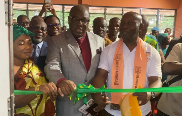 image-499-696x387 | Ghanaguardian.com People attend a ribbon-cutting ceremony as a man in a gray suit cuts a green ribbon with another man in a white shirt and orange sash, while onlookers cheer.