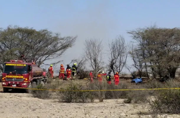 7e290c00-8e16-11f1-b8e8-d5f03f10fe6djpg | Ghanaguardian.com Firefighters in red gear and a red fire truck on a dry desert site, with yellow caution tape marking off the scene.