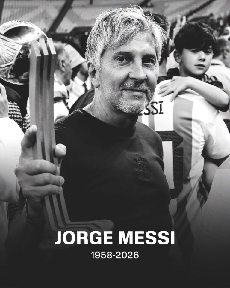 Black-and-white portrait of Jorge Messi holding a trophy at a sports event, with a fan in the background; memorial text reads 1958–2026.