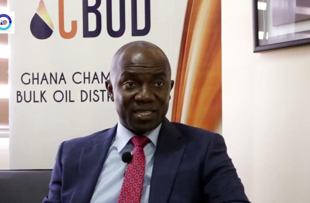 maxresdefault 1 | Ghanaguardian.com Man in a navy suit and pink tie speaks in an interview, microphone clipped to his lapel, with a banner reading 'GHANA CHAMBER BULK OIL DIST' behind him