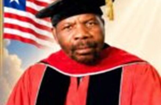no_translation_11935_e0cy2fufqun7bgm01pwyz9lm_no_translation_translation | Ghanaguardian.com Portrait of a man wearing a red academic gown and mortarboard with an American flag in the background.”