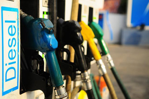 no_translation_8583_e0cy2fufqun7bgm01pwyz9lm_no_translation_translation | Ghanaguardian.com Diesel fuel pump nozzles at a gas station, blue nozzle in focus with other colored hoses in the background (fuel pumps).